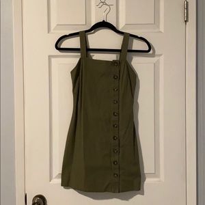 green fitted dress with off centered buttons